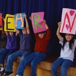 Students Holding Signs